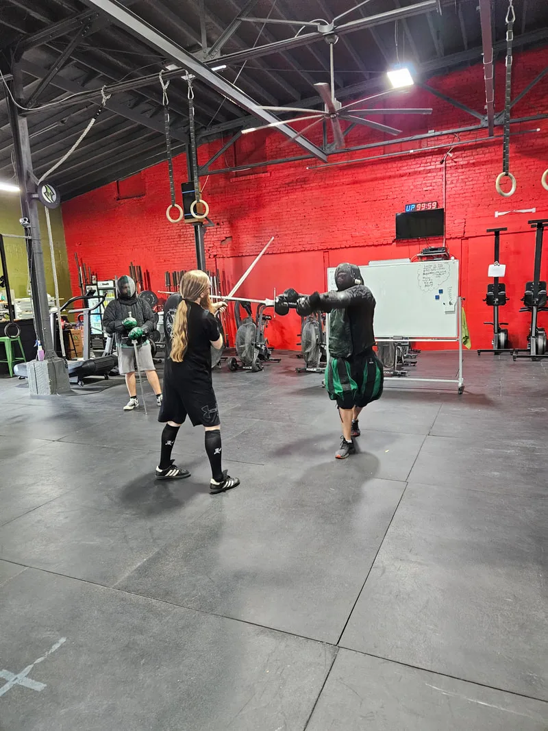 Jason and Chris teaching a longsword lesson to the adult class.