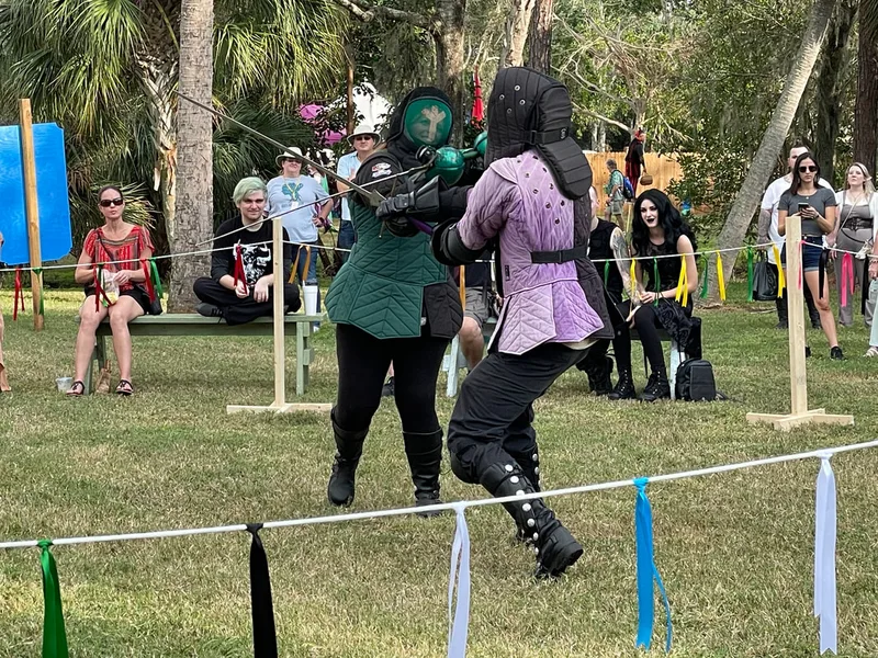 Steel Ring Academy instructor Amanda and Billy longsword fighting at the Suncoast Renaissance Festival.