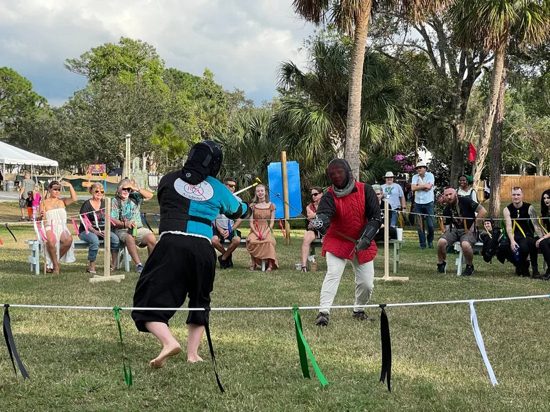 Steel Ring Academy instructors Ryan and Neal fighting with longswords at the Suncoast Renaissance Festival.