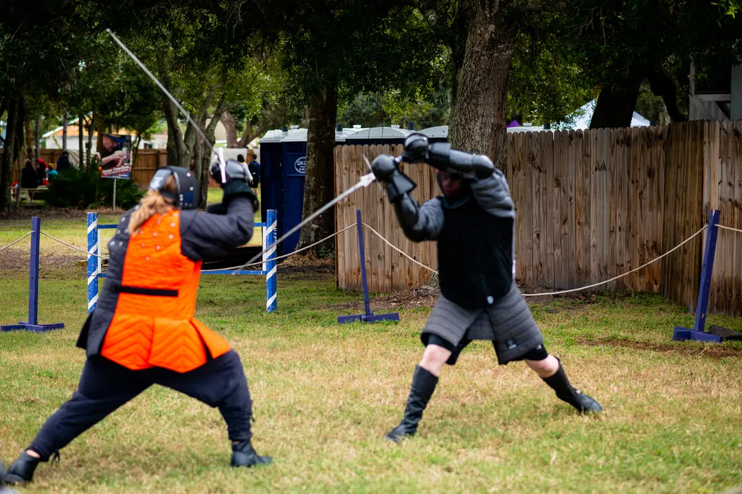 Students sparring with longswords at the Suncoast Renaissance Festival.