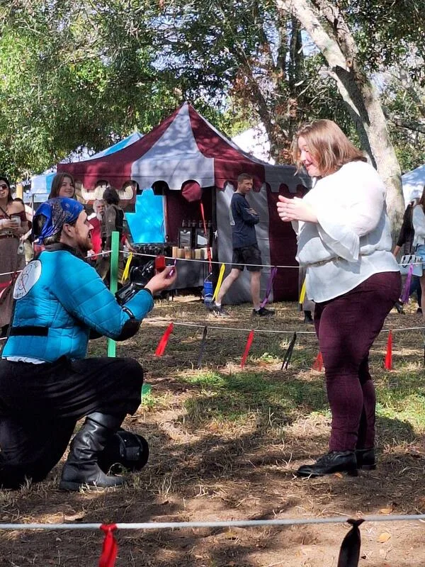 Ryan proposing during a demonstration at the Suncoast Renaissance Festival.