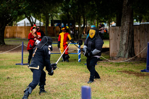 Steel Ring Academy fighters engaged in combat during a demonstration at the SunCoast Renaissance Festival.
